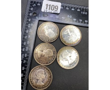 Five Canada silver dollars