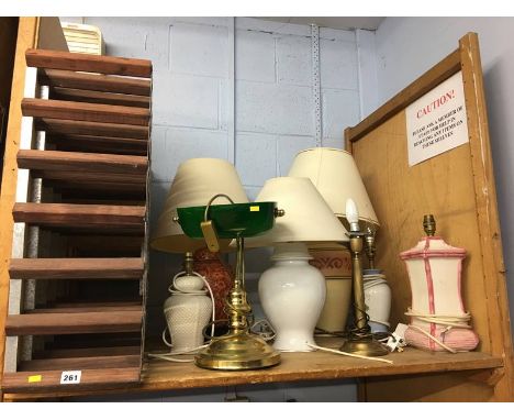 Shelf of assorted lamps etc.