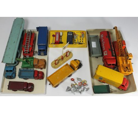 A collection of 13 assorted loose die-cast Dinky model vehicles in played with condition, including a 'Pullmore Car Transport