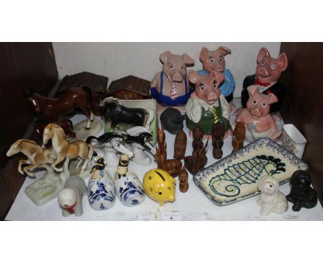 SECTION 4.  A set of five Wade ceramic Natwest piggy banks, together with a Royal Dux figure group of two leaping horses, Bes