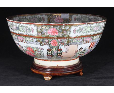 A late 19th/early 20th century Chinese Canton enamel bowl, decorated with interior scenes depicting figures conversing and dr
