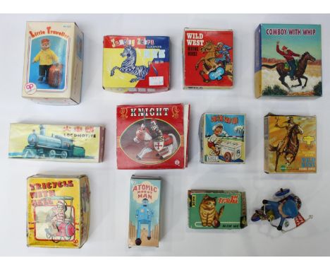 A collection of twelve assorted clockwork tinplate toys, largely boxed, comprising a Jumping Zebra, Cowboy with Whip, Little 