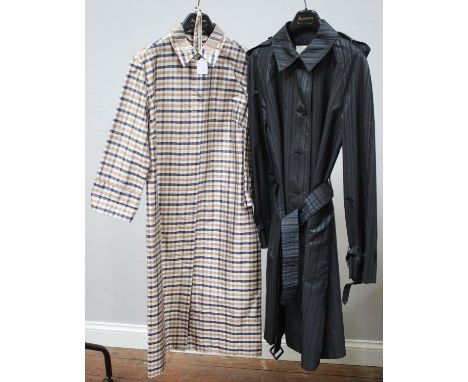 An Aquascutum ladies beige checked light weight rain mac, ladies uk size 12, measures approx. 100cm long x 45cm together with