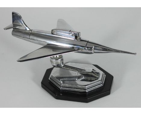 A novelty 'Jet Plane' chromium-plated table lighter, on ball and socket stand and elongated octagonal plinth, 28cm high 