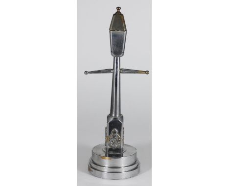 A novelty chromium-plated brass 'Trench Art' lamppost table lighter, the pedestal base of the lamppost mounted with a badge o