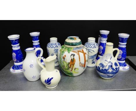 A pair of HM & Co blue and white baluster vases, various blue and white candlesticks and Delft jugs, together with a Famille 