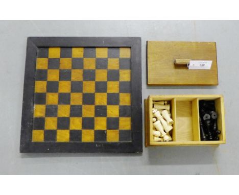 An early 20th century ebony and ivory chess set complete with chess board (a lot) 