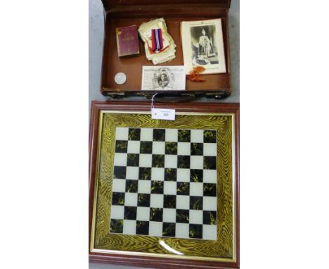 A vintage brown leather briefcase, contents, and a glass chess board (2) 