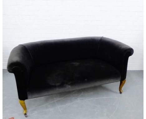 An upholstered scroll back two seater sofa, on cabriole supports, 72 x 152cm