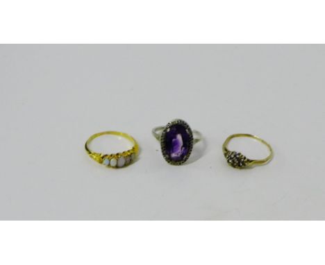 A five stone opal dress ring set in unmarked gold band together with a 9 carat gold dress ring and a silver and amethyst ring