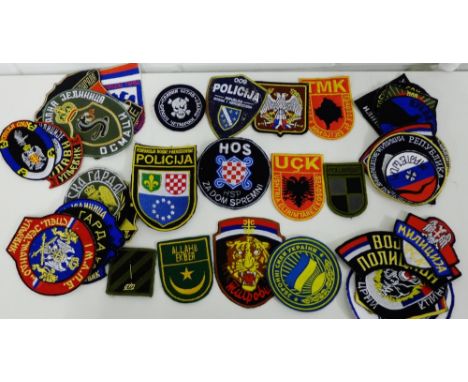 A collection of Republika Serpska, du (Balkans) unit badges for Army and Police units to include Arkan's Tigers, twenty seven