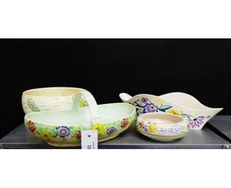 Poole pottery to include an oblong dish and a circular bowl, together with a Radford flower basket and an unmarked fruit bowl