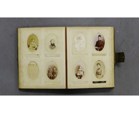 A Victorian photograph album containing a selection of portrait photographs 