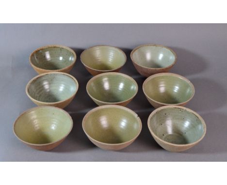 Leach Pottery; nine stoneware bowls, glazes vary from blue/grey to green, impressed pottery marks, diameter 14.5cm (9). CONDI