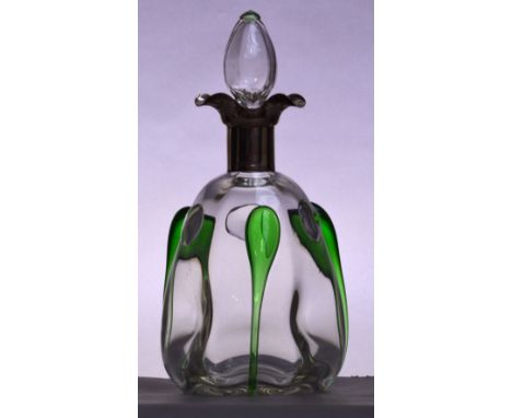 Attributed to STUART; an Edwardian clear glass decanter, the stopper with pale green tinted surmount above silver collar set 