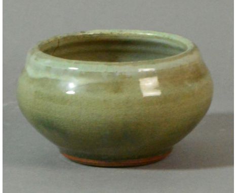 BERNARD LEACH (1887-1979) for Leach Pottery; a stoneware bowl covered in green glaze, impressed BL mark, diameter 12cm. (D) C
