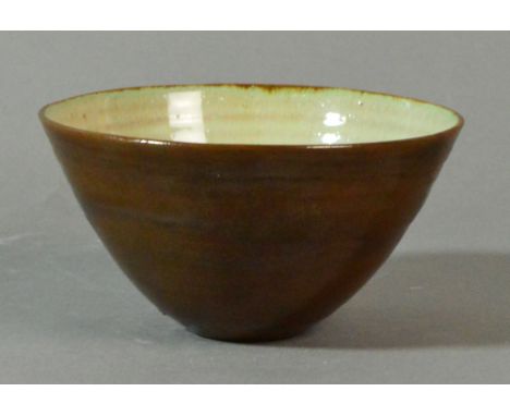 LUCIE RIE (1902-1995) & HANS COPER (1920-1981); a red earthenware bowl, pale yellow/green glaze interior, brown glaze exterio