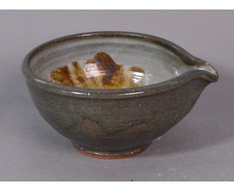 SHIGEYOSHI ICHINO (born 1942) for Leach Pottery; a stoneware pouring bowl with iron splash decoration on a grey ground, impre