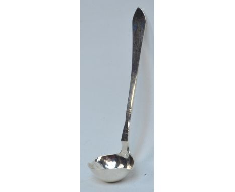 GEORG JENSEN; a small hallmarked silver double lipped cream ladle with part beaten bowl, in the "Continental" pattern also kn