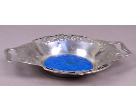 LIBERTY & CO; a polished pewter enamel decorated twin handled bowl, the pierced heart shaped handles flanked by pierced leaf 