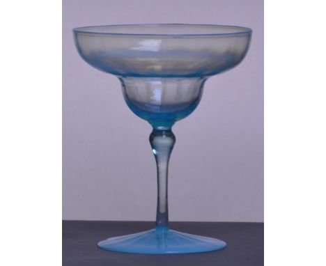 JAMES POWELL WHITEFRIARS; a blue opal champagne glass with double ogee bowl, slender stem and dimpled foot, height 12.4cm. CO