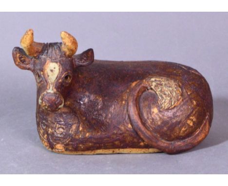 ROSEMARY WREN (1922-2013) for Oxshott Pottery; a stoneware seated brown cow, impressed wren mark, length 20cm. (D) CONDITION 