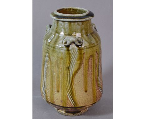 PHIL ROGERS (born 1951); a salt glazed vase with lug handles, running green ash glaze, impressed PR mark (partially glaze fil