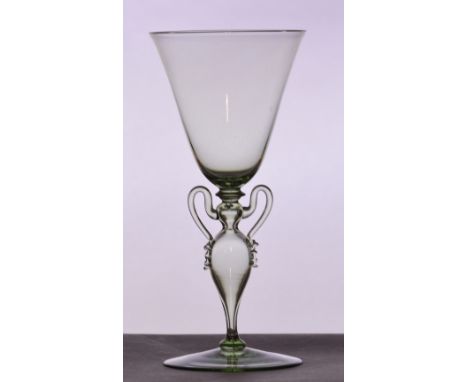 JAMES POWELL WHITEFRIARS; a pale green tinted "Façon de Venise"  with tapering bowl and blown urn shaped stem to plain foot, 