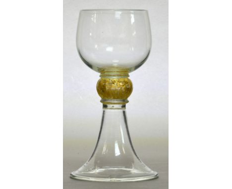 JAMES POWELL WHITEFRIARS; a glass with rounded funnel bowl above gold leaf included knopped stem of moulded form to an invert