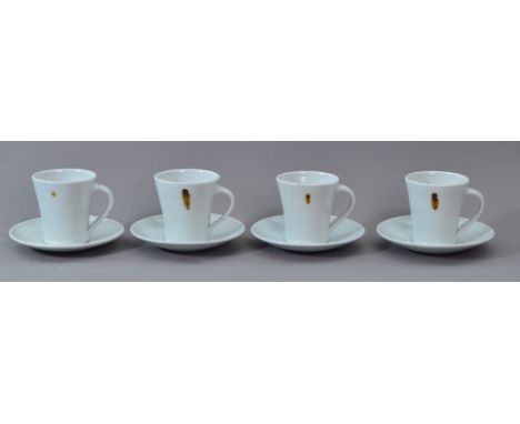EDWARD HUGHES (1953-2006); four porcelain cups and saucers covered in white glaze with iron spots, impressed EH marks, height