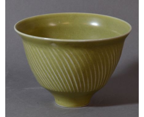 DAVID LEACH (1911-2005) for Lowerdown Pottery; a porcelain fluted bowl covered in green celadon glaze, impressed DL mark, dia