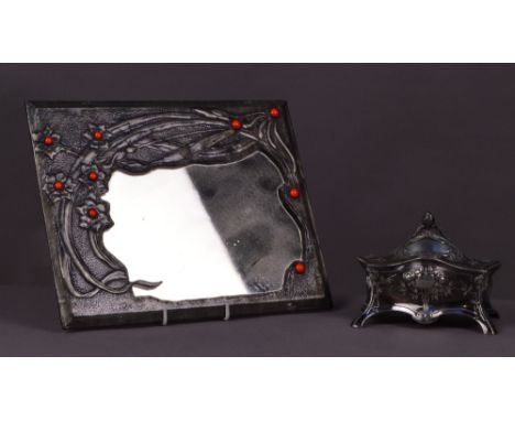 WMF; an Art Nouveau polished pewter trinket box of shaped rectangular form, the domed hinged lid enclosing a lined interior w