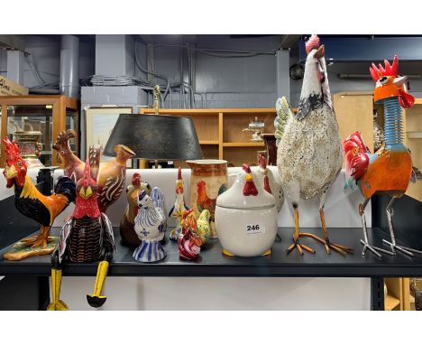 A quantity of metal, ceramic and wood chickens, tallest 47cm.
