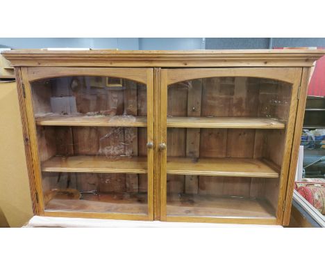 A three shelf pine wall cabinet, 130 x 77 x 32cm.