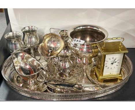 A quantity of silverplate and a carriage clock.