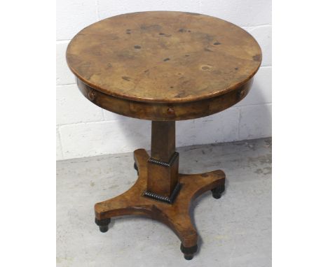 A William IV walnut drum table with quarter-matched veneered walnut top surmounting three frieze drawers, on a square pillar 
