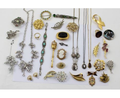 A quantity of vintage and contemporary costume jewellery to include necklaces, brooches etc.