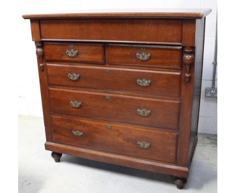 A Victorian mahogany Scotch chest with hidden frieze drawer surmounting a two-over-three drawer configuration, supported on t