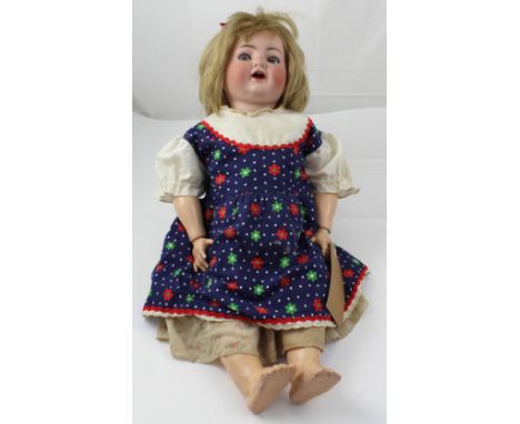 A German made ceramic head composite body doll by Simon &amp; Halbig No.126, with opening and closing shifty eyes and open mo