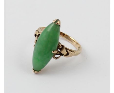 A jade dress ring marked 14k with navette shaped stone, size N1/2, approx 4.2g. CONDITION REPORT Slight thinning to band at b