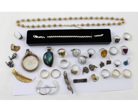 A quantity of mainly silver and white metal jewellery to include a large mother of pearl pendant in silver mount, various sil