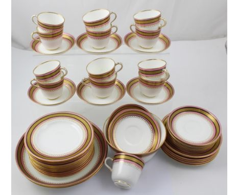 A Mintons 19th century part tea service comprising twelve cups, sixteen saucers, eighteen side plates, two sandwich plates an