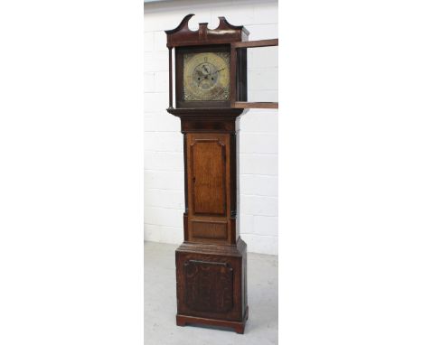 An early 19th century oak and mahogany with day longcase clock, the square brass dial set with seconds and date apertures, si