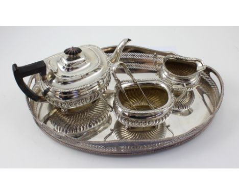 An Edward VII hallmarked silver three piece tea service to include a teapot, sucrier and milk jug, Martin Hall &amp; Co Ltd, 