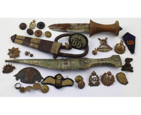 A small collection of WWII military cloth and metal cap badges, a vintage Eastern dagger in metal scabbard, length 34cm, and 