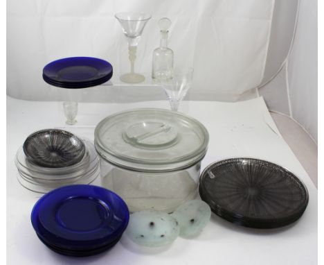 A large glass cake bowl, two non-matching wine glasses, a quantity of c1960s decorative glass plates and shallow bowls, thirt