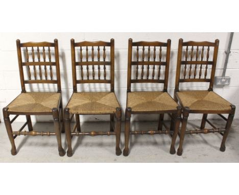 A set of four rush seat country style kitchen chairs with bobbin turned backs, and four assorted single chairs in various sta