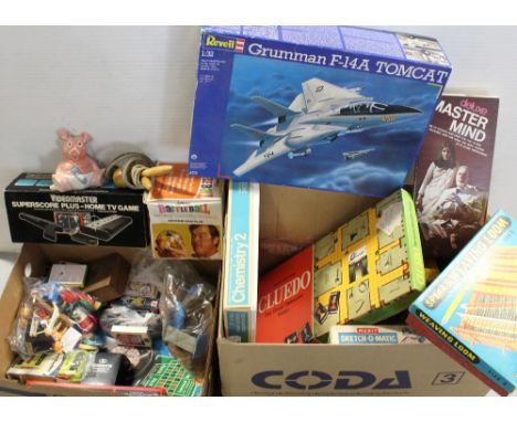 A large quantity of vintage children's games and toys to include a Thomas Salter chemistry set, Cluedo, a Revel Grumman F-14A