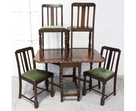 An early-to-mid 20th century oak drop-leaf table with piecrust edge and barleytwist supports united by a peripheral stretcher