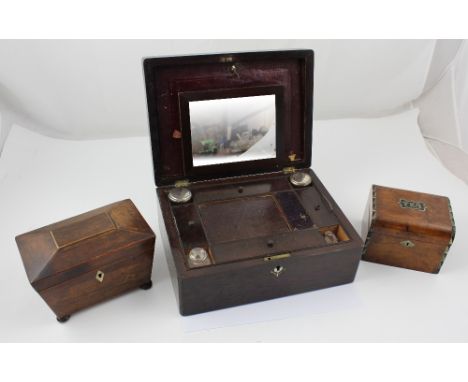 A Regency mahogany tea caddy of sarcophagus form raised on squat bun feet, height 12.5cm, a walnut and mother of pearl inlaid